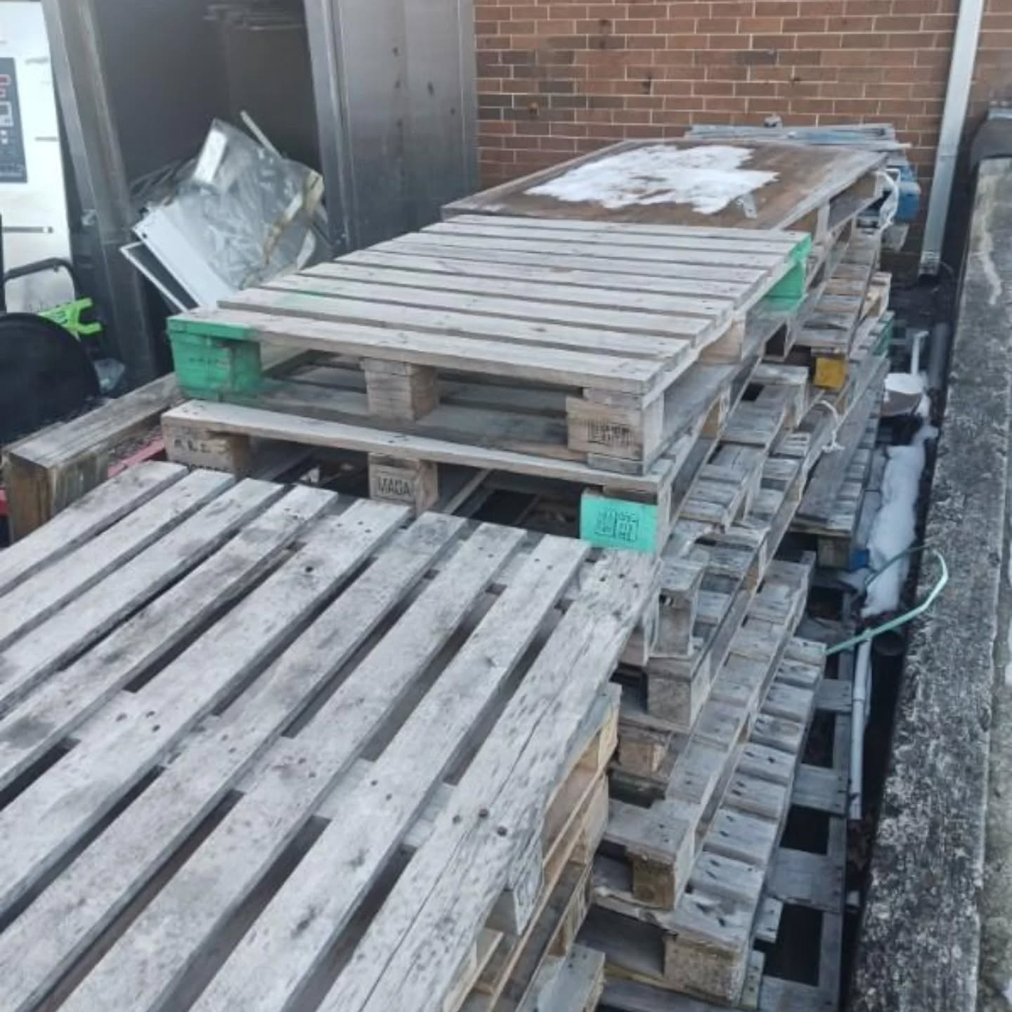 Wooden pallets stacked and ready for hauling